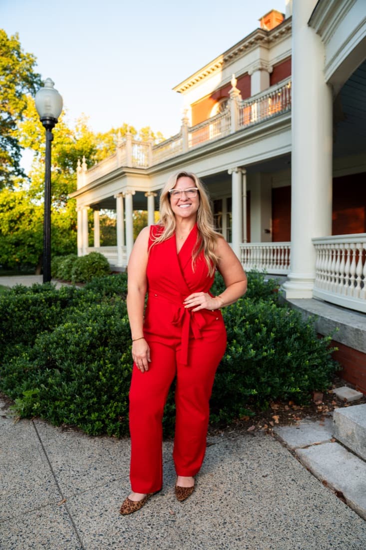 A Here Realty agent in front of the porch