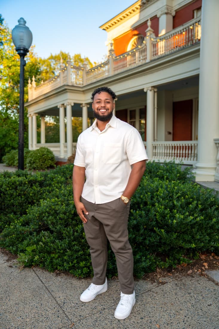 A Here Realty agent in front of the porch