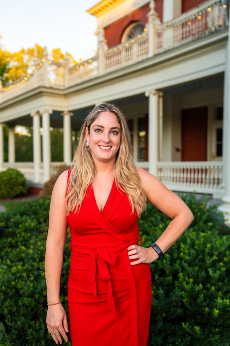A Here Realty agent in front of the porch